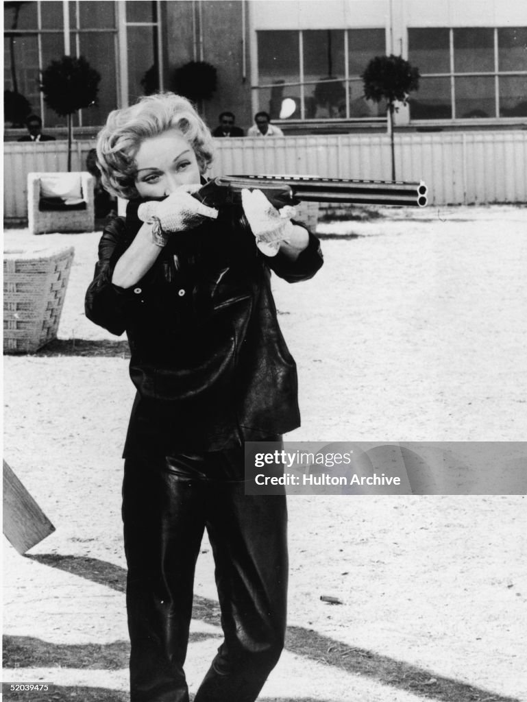 Dietrich Aims Her Gun