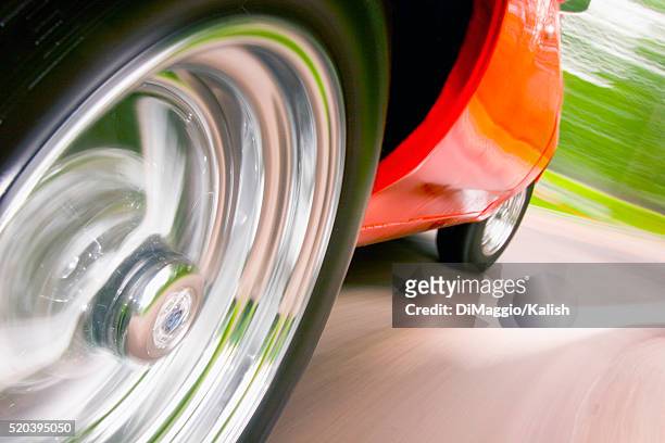 spinning wheels of classic car - hub stock pictures, royalty-free photos & images