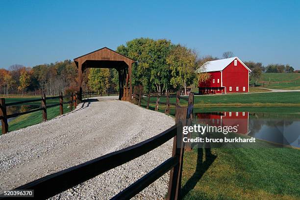 covered bridge near a barn - rural ohio stock pictures, royalty-free photos & images