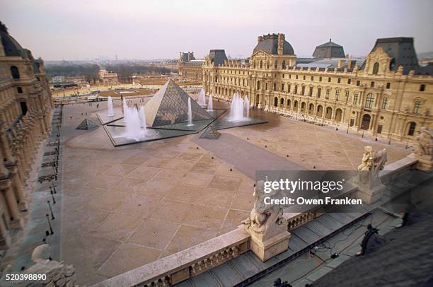 louvre courtyard and pyramids - louvre pyramid stock pictures, royalty-free photos & images