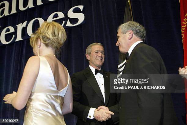 President George W. Bush greets guests at the Salute to Heroes Veterans Inaugural Ball 20 January 2005 in Washington, DC. Bush reached out to US...