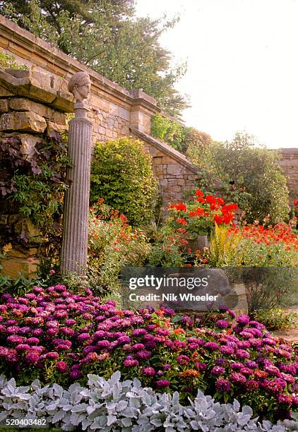 Flowers in the garden of 13C Hever Castle, former property of King Henry VIII and William Astor, in Kent in Southern England