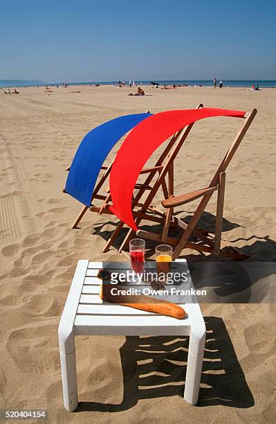 red and blue chairs with white table - calvados stock pictures, royalty-free photos & images