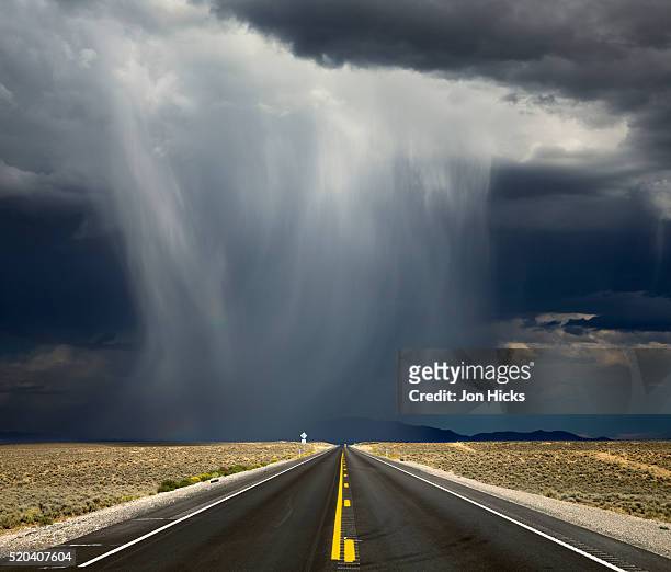 a storm crosses highway 50, 'america's loneliest road'. - nevada stockfoto's en -beelden