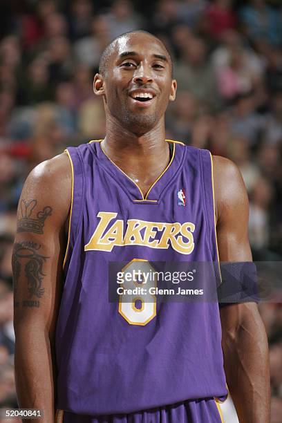 Kobe Bryant of the Los Angeles Lakers smiles during the game against the Dallas Mavericks at American Airlines Arena on January 5, 2005 in Dallas,...