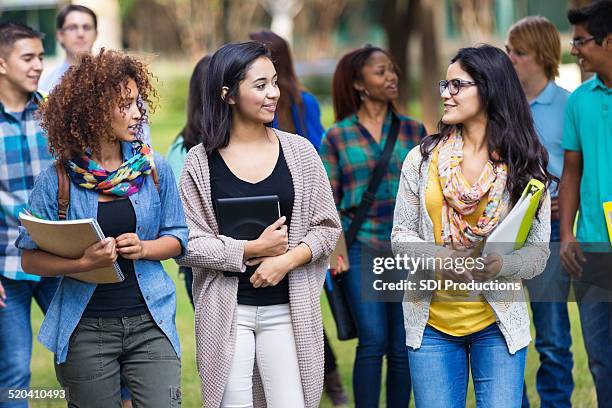 cute college girls talking together on campus - popular stock pictures, royalty-free photos & images