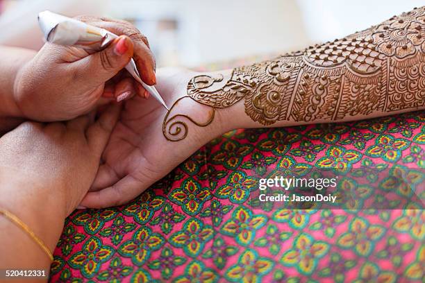 traditional mehndi tattoo for a indian bridal celebration - henna tattoo stock pictures, royalty-free photos & images