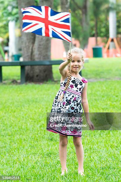 waving a british flag - child waving stock pictures, royalty-free photos & images