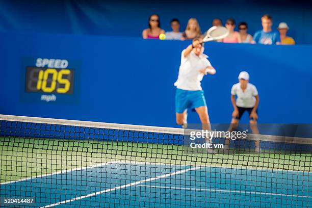 professional tennis player in action - blue tennis court stock pictures, royalty-free photos & images