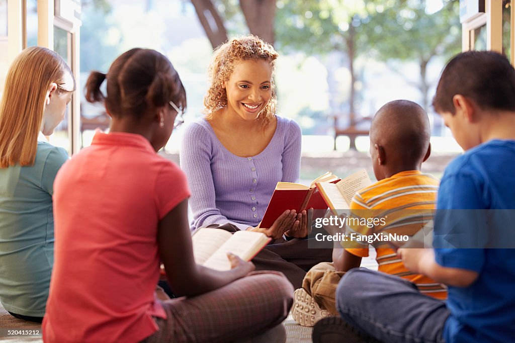 Librarian reading to a group of children