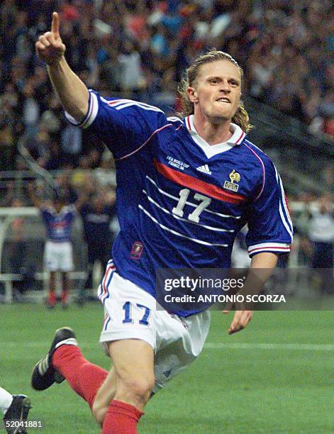 - French Emmanuel Petit jubilates after scoring the 3rd goal for his team, 12 July at the Stade de France in Saint-Denis, near Paris, during the 1998...