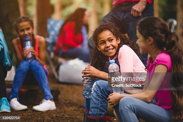 making friends on a field trip - girl guide association stock pictures, royalty-free photos & images