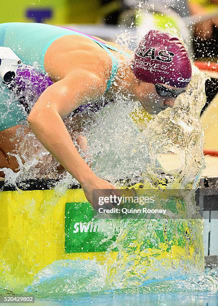Madeline Groves of Australia sprays herself with water before competing in the Women's 200 Metre Butterfly during day four of the Australian Swimming...