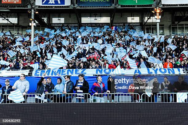 Racing 92 fans with a banner reading "Take Up To Lyon" before the European Rugby Champions Cup Quarter Final between Racing 92 v RC Toulon at Stade...