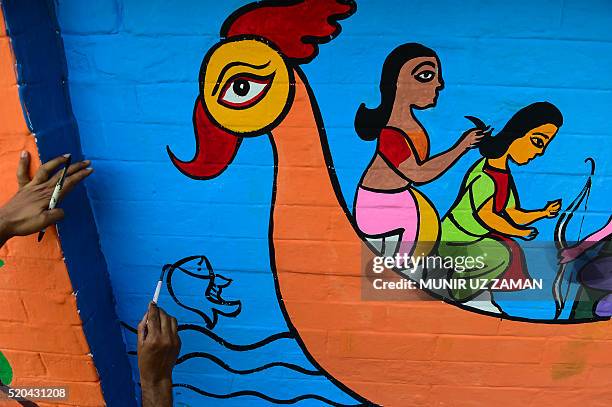 Bangladeshi Dhaka University Art Institute student paints a a mural as a part of Bengali New Year preparations in Dhaka on April 11, 2016. The...