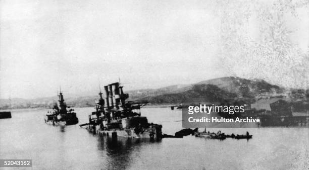 View of damaged Russian warships, following a Japanese attack in Part Arthur, China, early February, 1904. The Japanese attack, on February 9, was...