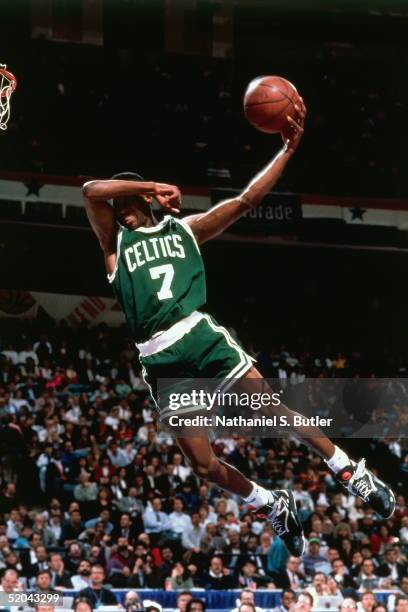 Dee Brown of the Boston Celtics goes up for slam dunk during the Slam Dunk Contest in the 1991 NBA All-Star Week on February 9, 1991 at Charlotte...