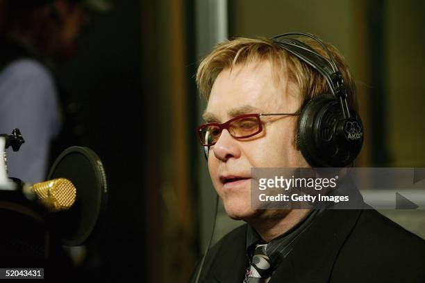 Sir Elton John records the charity cover of Eric Clapton's "Tears In Heaven" Tsunami Relief Single at Whitfield Studios on January 20, 2005 in...