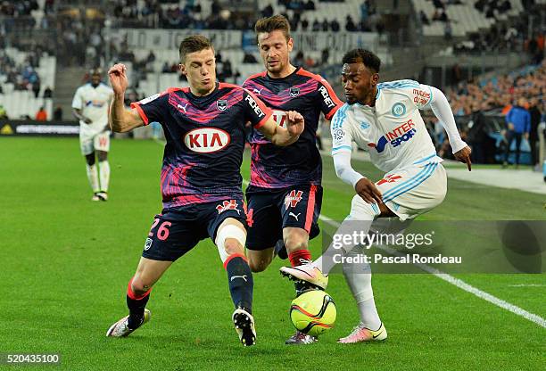 Georges Kévin Nkoudou Mbida from Marseille kick the ball in front of Frédéric Guilbert and Mathieu Debuchy from Bordeaux during the French League 1...