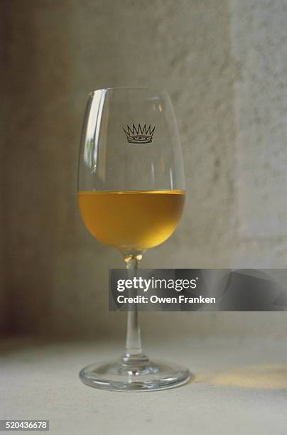 glass of sauternes white wine - sweet wine stock-fotos und bilder