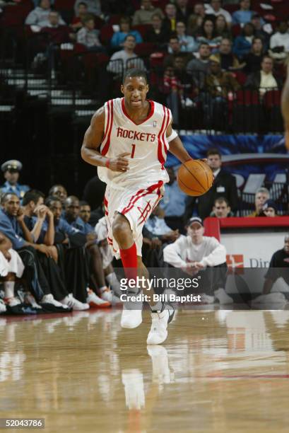 Tracy McGrady of the Houston Rockets brings the ball upcourt during the game against the Charlotte Bobcats at Toyota Center on December 22, 2004 in...