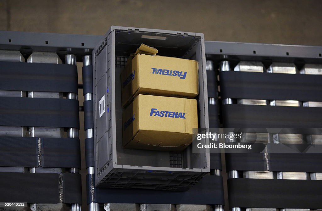 Fasten Inventory Boxes A crate containing boxes of hardware moves down a conveyor belt... News ...