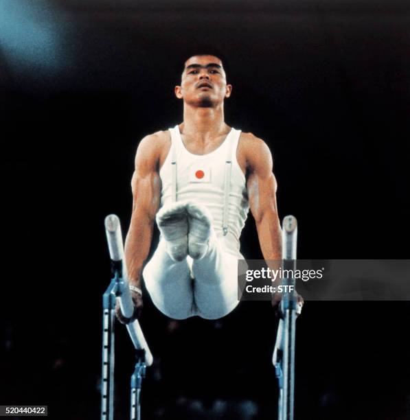 Japan gymnast Sawao Kato performs,on September 07, 1972 at Munich during the parallel bars event of the Summer Olympic games.