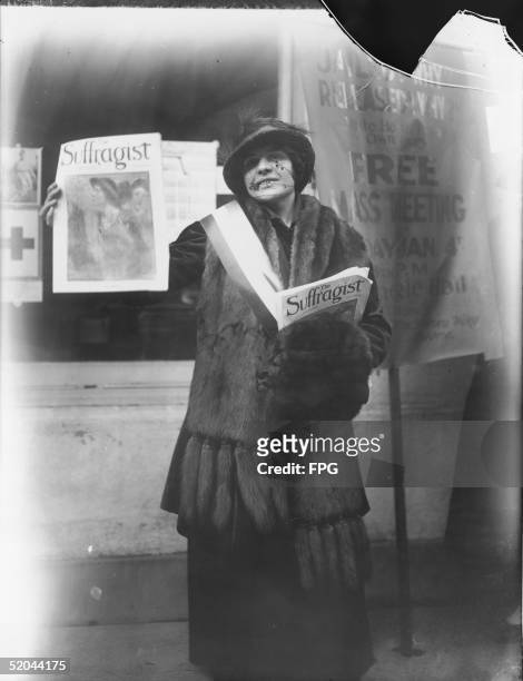 Woman advertises The Suffragist magazine, mid 1910s. Suffragist was started in 1913 by Alice Paul and the Congressional Union for Women Suffrage.