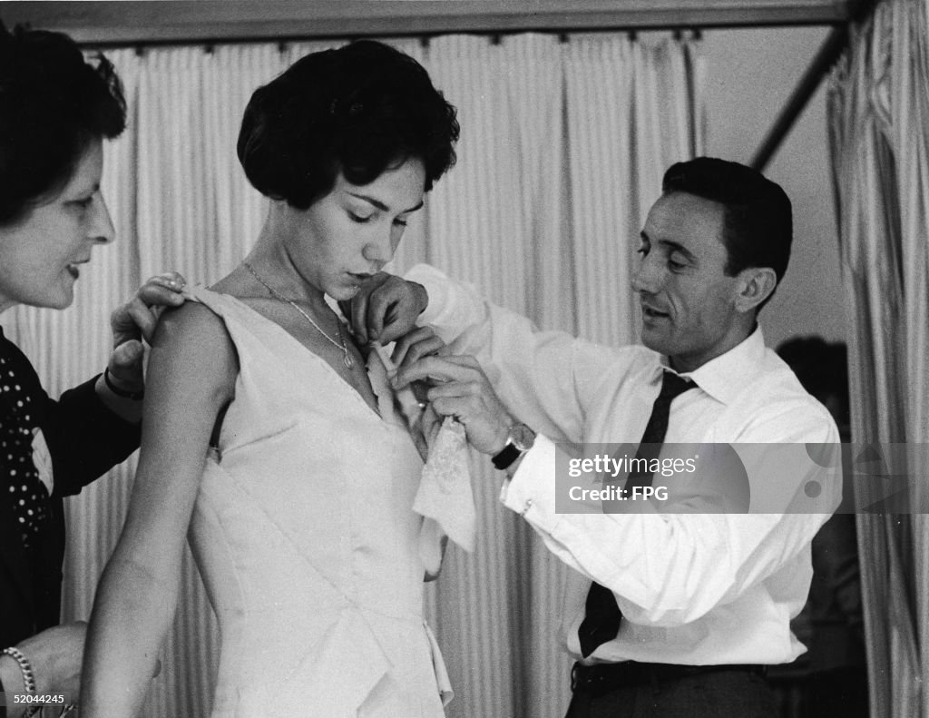 Guy Laroche Alters A Dress During a Fitting