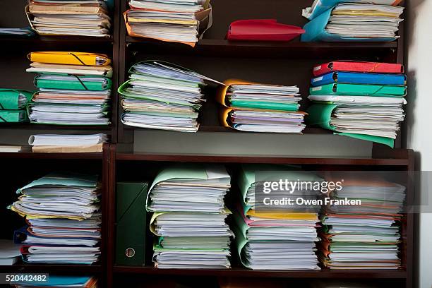 clients' folders in a lawyer's office - sistema legale foto e immagini stock