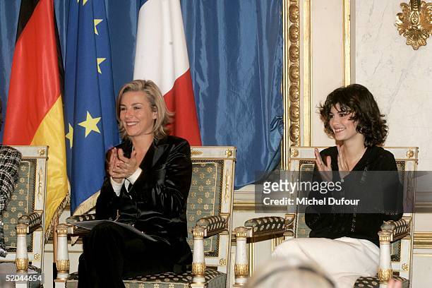 Audrey Tautou waits alongside Laurence Ferrari at a ceremony in which she and Daniel Bruehl received the Adenauer-de-Gaulle prize January 21, 2005 at...