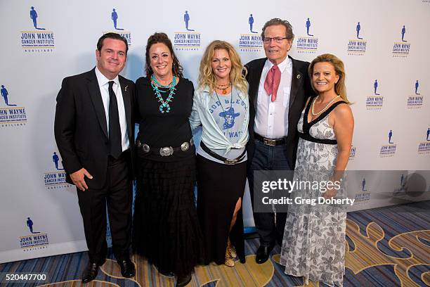 Michael Wayne , Auxiliary President of the John Wayne Cancer Institute Anita Swift, Marissa Wayne , Chairman Patrick Wayne and Melanie Wayne attend...