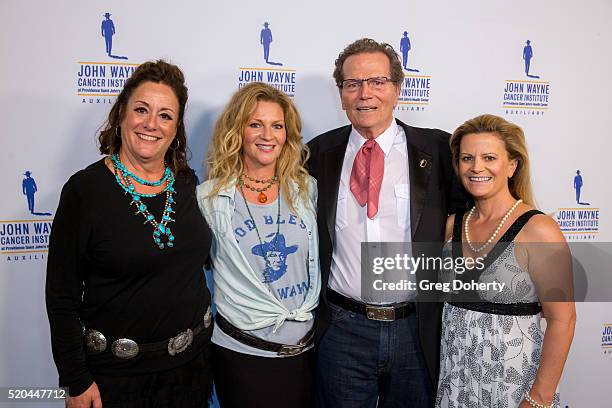 Auxiliary President of the John Wayne Cancer Institute Anita Swift, Marissa Wayne , Chairman Patrick Wayne and Melanie Wayne attend the John Wayne...