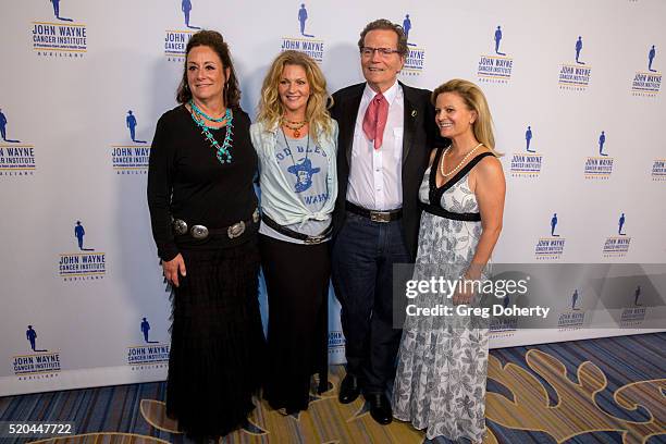 Auxiliary President of the John Wayne Cancer Institute Anita Swift, Marissa Wayne , Chairman Patrick Wayne and Melanie Wayne attend the John Wayne...