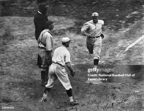 Ross Youngs of the New York Giants runs across home plate during a 1921 World Series game against the New York Yankees. Ross Youngs played for the...