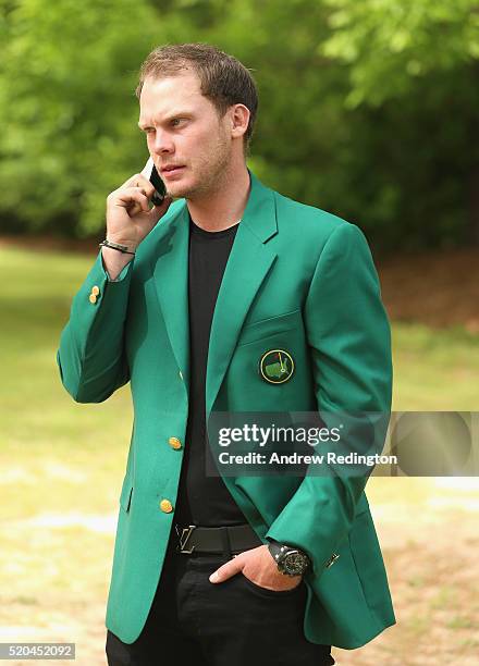 Danny Willett of England, the 2016 Masters champion, poses with his green jacket at his rented house on April 11, 2016 in Augusta, Georgia.