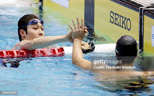 Kosuke Hagino is congratulated by Daiya Seto after winning the Men's 200m Individual Medlay final during day six of the Japan Swim 2016 at Tokyo...