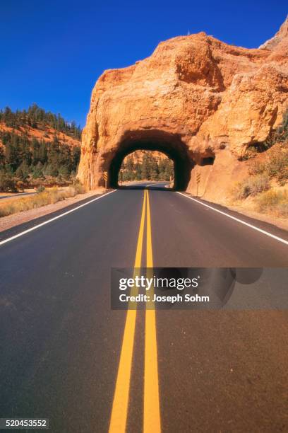 highway passing through a hill - swimming lane marker bildbanksfoton och bilder