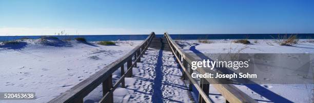 boardwalk covered by white sand - footsteps on a boardwalk bildbanksfoton och bilder