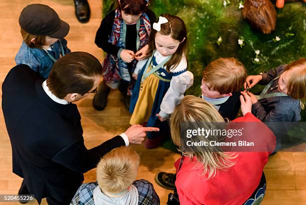 Prince Daniel of Sweden talks to children during the opening of the exhibition 'Frech, wild & wunderbar - schwedische Kinderbuchwelten' at the...