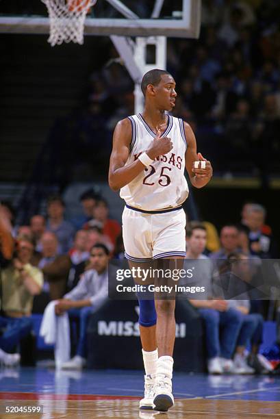 Danny Manning of the University of Kansas Jayhawks looks over to the sidelines as he walks on the court during a game NCAA game in 1986.