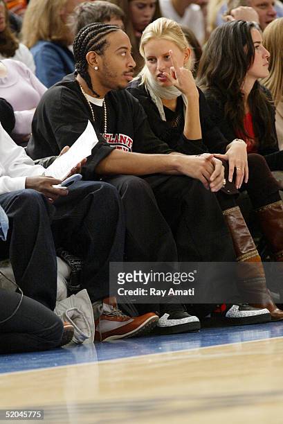 Rapper Ludacris chats with supermodel Karolina Kurkova courtside at the New York Knicks vs Houston Rockets NBA game at Madison Square Garden on...