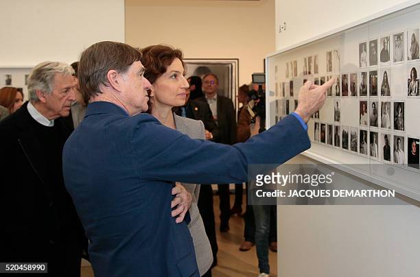 French director and cinematheque Francaise president Costa-Gavras, US director Gus van Sant, and French culture minister Audrey Azoulay look at...