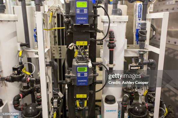 the grey water recycling system at the crystal building - siemens stock pictures, royalty-free photos & images