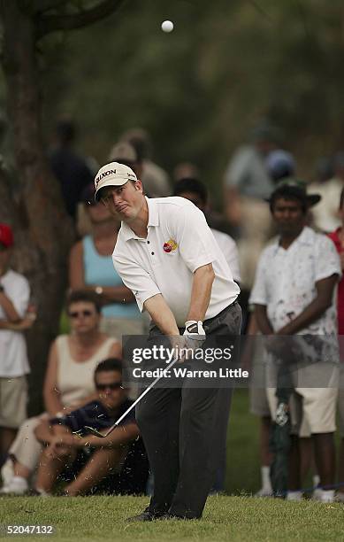 Tim Clark of South Africa chips onto the 13th green during the third round of the South African Airways Open at Durban Country Club on January 22,...