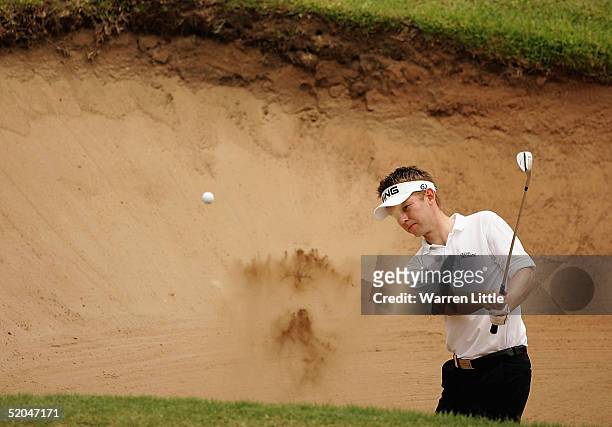 Fredrik Henge of Sweden plays out of the greenside bunker on the fourth hole during the third round of the South African Airways Open at Durban...