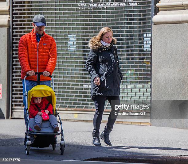 Chelsea Clinton, Marc Mezvinsky and their daughter Charlotte are seen on April 11, 2016 in New York City.