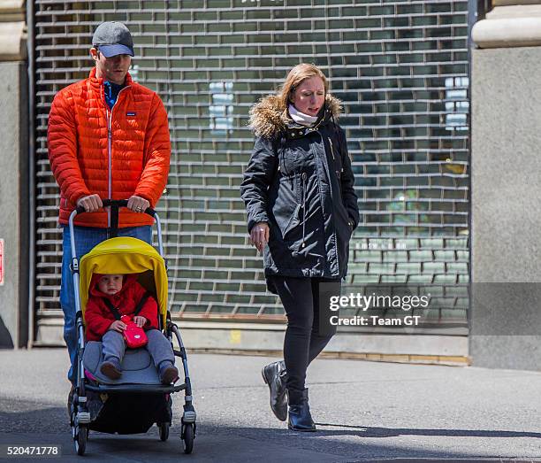 Chelsea Clinton, Marc Mezvinsky and their daughter Charlotte are seen on April 11, 2016 in New York City.
