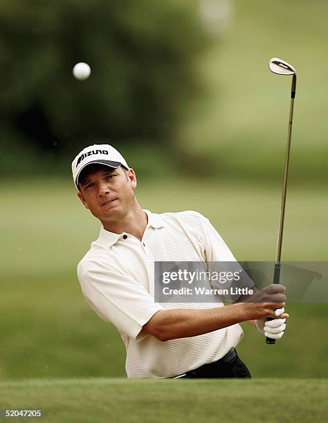 Andrew McLardy of South Africa plays out of the greenside bunker on the 13th green during the third round of the South African Airways Open at Durban...