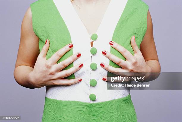 woman touching her breast - seno fotografías e imágenes de stock